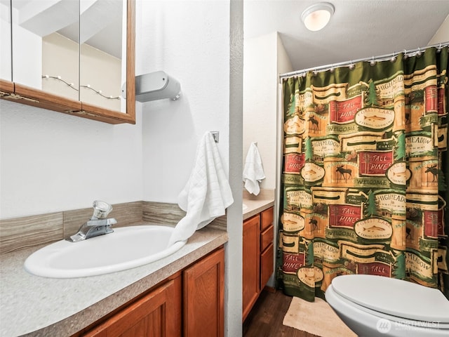 1201 Summit Lake Shore Rd NW, East Olympia, WA 98502 - bathroom featuring vanity, wood finished floors, toilet, and a shower with curtain