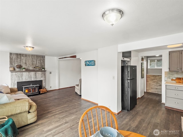 1201 Summit Lake Shore Rd NW, East Olympia, WA 98502 - living area featuring dark wood-style flooring, baseboards, and a fireplace