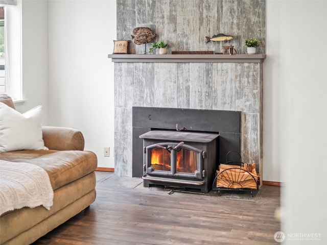 1201 Summit Lake Shore Rd NW, East Olympia, WA 98502 - detailed view of wood finished floors, a wood stove, and baseboards