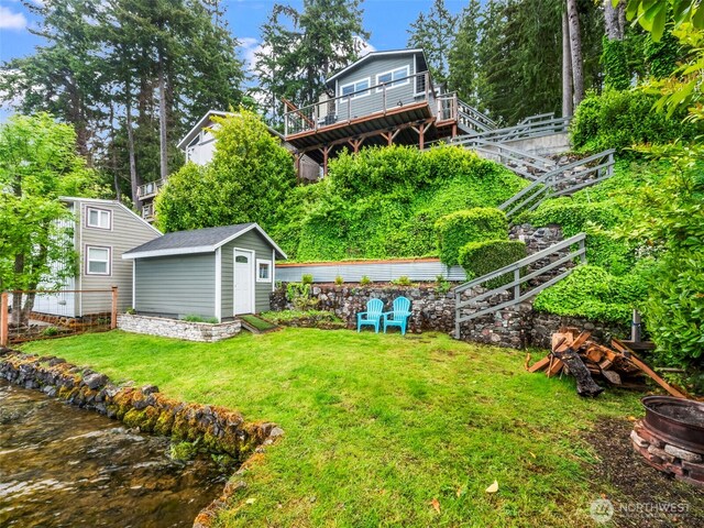 1201 Summit Lake Shore Rd NW, East Olympia, WA 98502 - view of grassy yard featuring a fire pit and stairway