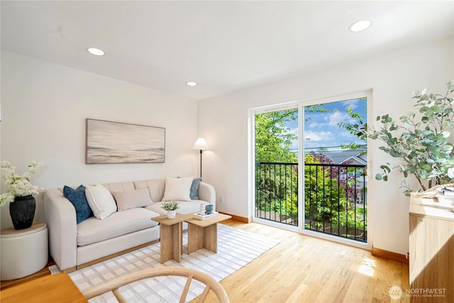 6348 34th Ave SW Unit C, Seattle, WA 98126 - living room with baseboards, wood finished floors, and recessed lighting
