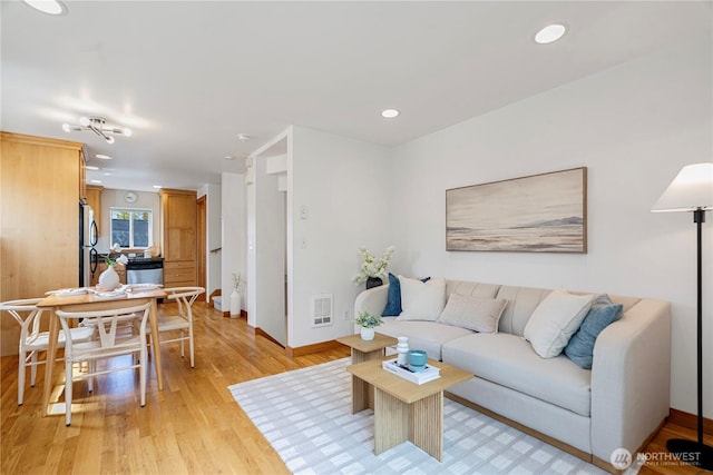 6348 34th Ave SW Unit C, Seattle, WA 98126 - living room featuring light wood-style flooring, baseboards, and recessed lighting