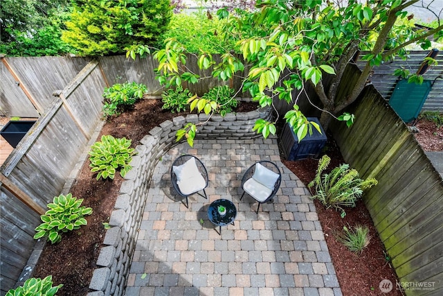 6348 34th Ave SW Unit C, Seattle, WA 98126 - fenced backyard featuring a patio