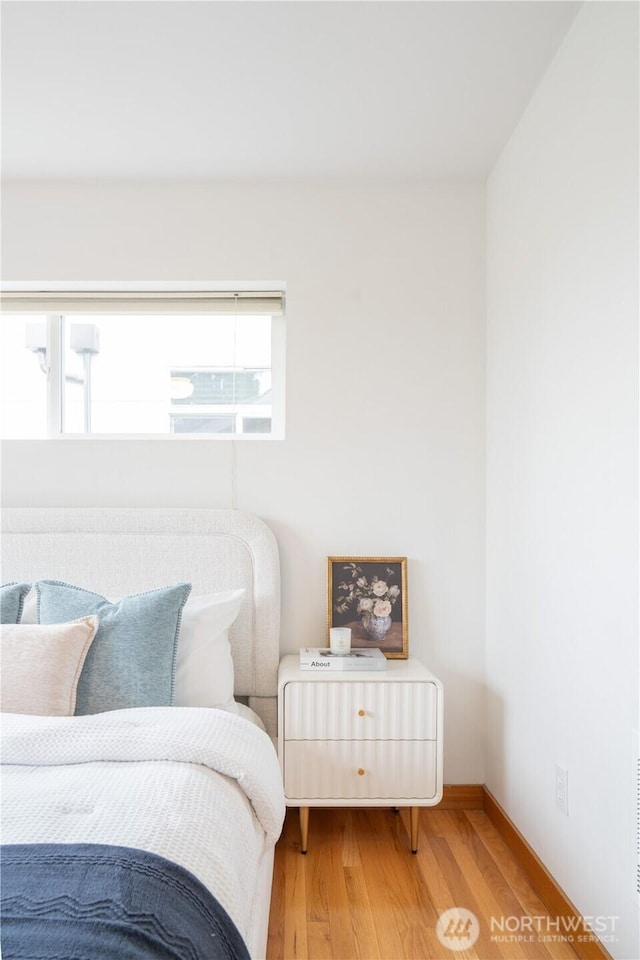 6348 34th Ave SW Unit C, Seattle, WA 98126 - bedroom featuring light wood-style flooring and baseboards
