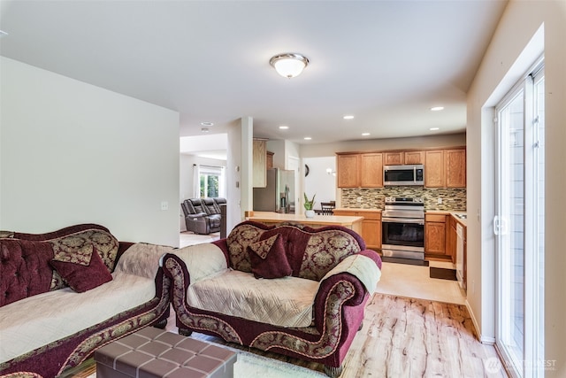 11710 SE 310th St, Auburn, WA 98092 - living area with light wood-type flooring and recessed lighting