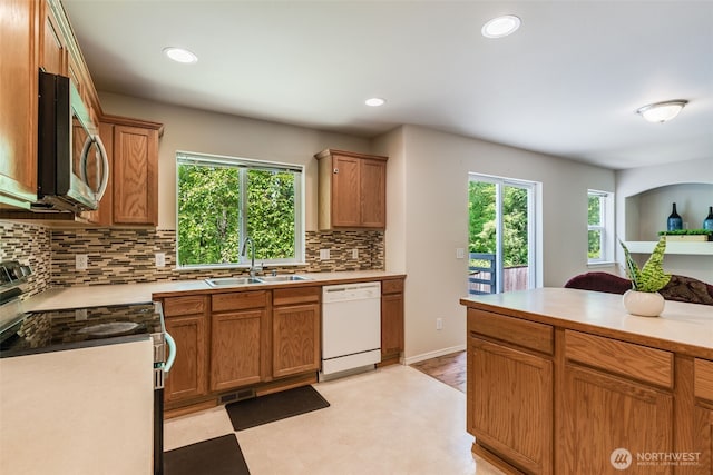 11710 SE 310th St, Auburn, WA 98092 - kitchen featuring appliances with stainless steel finishes, a sink, tasteful backsplash, light countertops, and recessed lighting