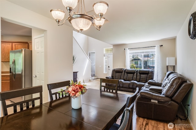 11710 SE 310th St, Auburn, WA 98092 - dining space with a chandelier and light wood-style flooring