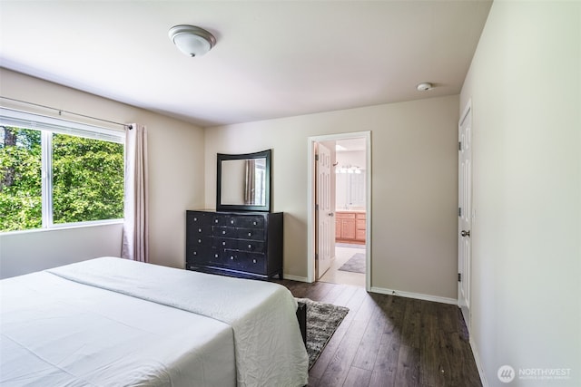 11710 SE 310th St, Auburn, WA 98092 - bedroom with dark wood-style flooring, baseboards, and connected bathroom