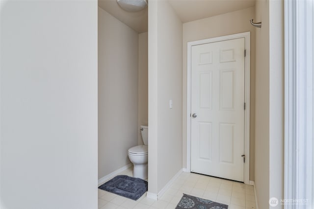 11710 SE 310th St, Auburn, WA 98092 - bathroom featuring toilet, baseboards, and tile patterned floors