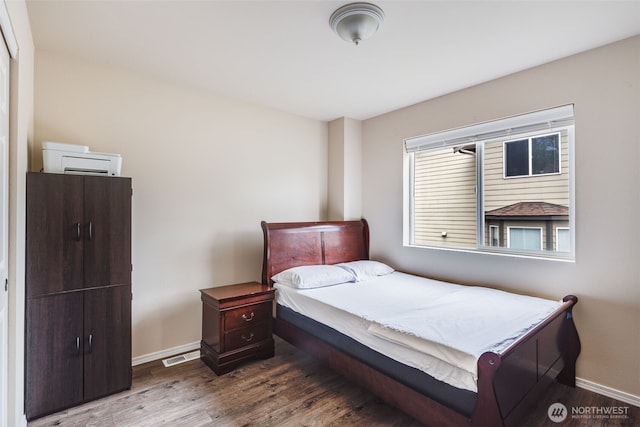 11710 SE 310th St, Auburn, WA 98092 - bedroom featuring baseboards and wood finished floors