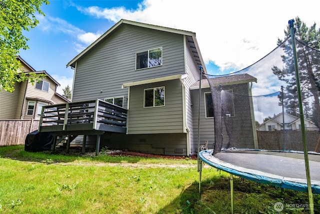 11710 SE 310th St, Auburn, WA 98092 - back of property featuring a trampoline, a wooden deck, and crawl space