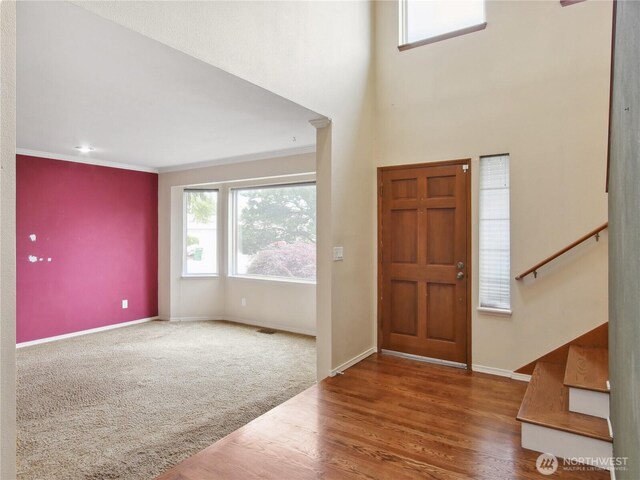 1015 SW 348th Pl, Federal Way, WA 98023 - foyer entrance with baseboards, wood finished floors, ornamental molding, and stairs