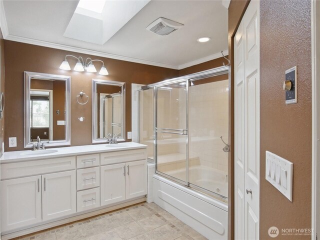 1015 SW 348th Pl, Federal Way, WA 98023 - bathroom featuring a skylight, ornamental molding, double vanity, shower / bath combination with glass door, and tile patterned flooring