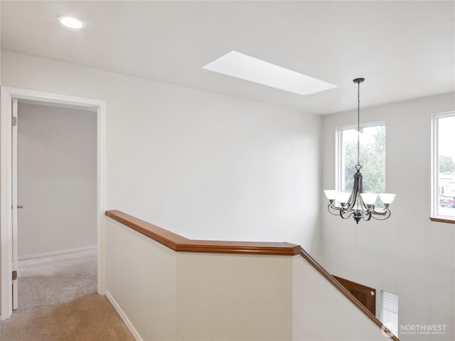 1015 SW 348th Pl, Federal Way, WA 98023 - corridor with a skylight, an upstairs landing, a chandelier, light carpet, and recessed lighting