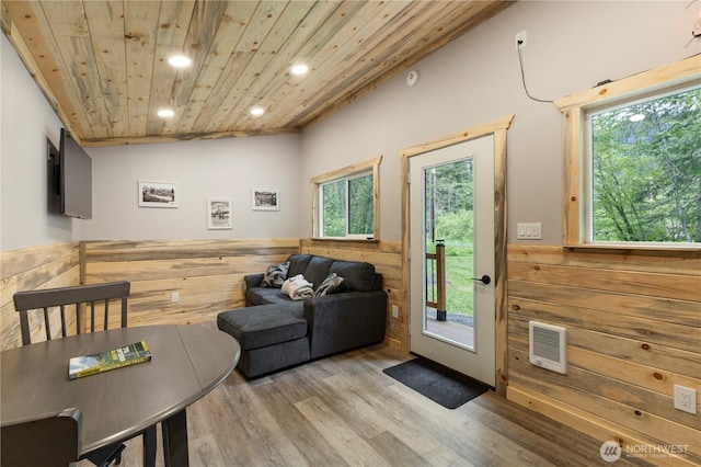 34208 343rd Avenue Ct E, Ashford, WA 98304 - doorway to outside featuring wooden ceiling, wood finished floors, plenty of natural light, recessed lighting, and a wainscoted wall