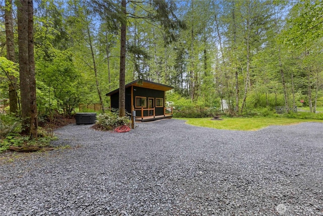 34208 343rd Avenue Ct E, Ashford, WA 98304 - view of yard with an outbuilding, a wooded view, and driveway
