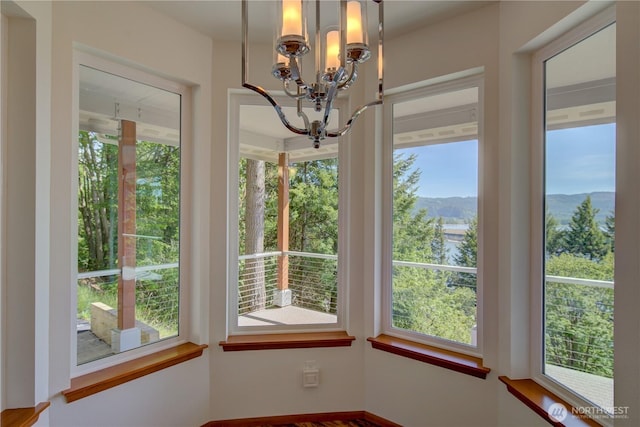 46 Wildwood Ln, Cathlamet, WA 98612 - unfurnished dining area featuring a chandelier and a mountain view