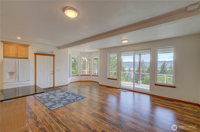 46 Wildwood Ln, Cathlamet, WA 98612 - unfurnished living room featuring baseboards, wood finished floors, a chandelier, recessed lighting, and a mountain view