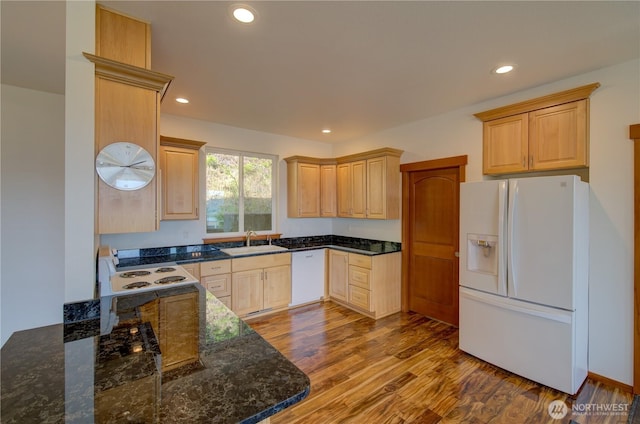46 Wildwood Ln, Cathlamet, WA 98612 - kitchen with white appliances, wood finished floors, a sink, dark stone counters, and recessed lighting