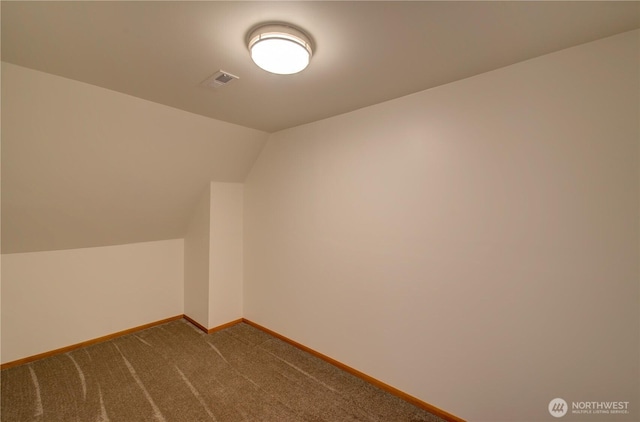 46 Wildwood Ln, Cathlamet, WA 98612 - additional living space featuring vaulted ceiling, dark colored carpet, and baseboards