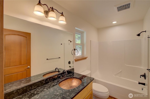 46 Wildwood Ln, Cathlamet, WA 98612 - bathroom with toilet, vanity, and bathtub / shower combination