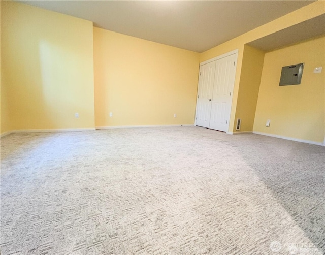 7732 Fairway Ave SE Unit 203, Snoqualmie, WA 98065 - empty room featuring light colored carpet, baseboards, and electric panel