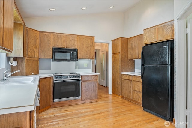 1515 19th Ave, Longview, WA 98632 - kitchen with black appliances, a sink, light wood-style floors, light countertops, and recessed lighting
