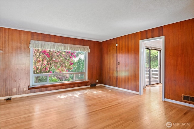 1515 19th Ave, Longview, WA 98632 - empty room with wood finished floors, wooden walls, and baseboards