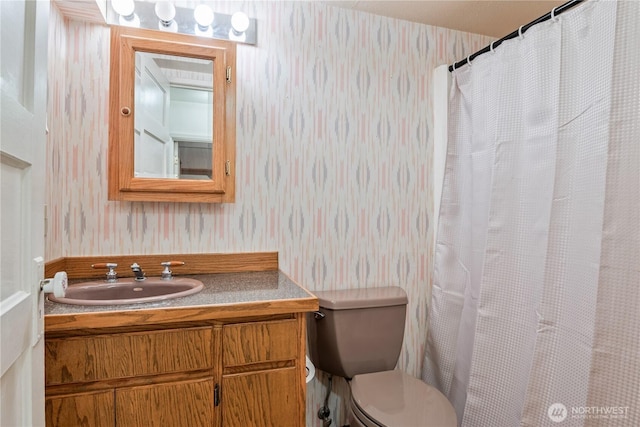 1515 19th Ave, Longview, WA 98632 - full bathroom featuring wallpapered walls, vanity, toilet, and a shower with shower curtain