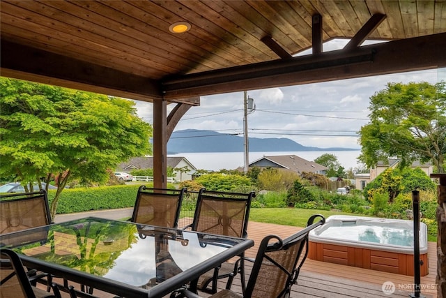 2570 Island View Ln, Lummi Island, WA 98262 - view of patio featuring outdoor dining area and a hot tub