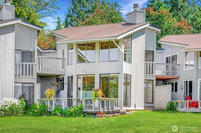 2877 N Nugent Rd N Unit M3, Lummi Island, WA 98262 - back of house featuring a chimney, a yard, and a shingled roof