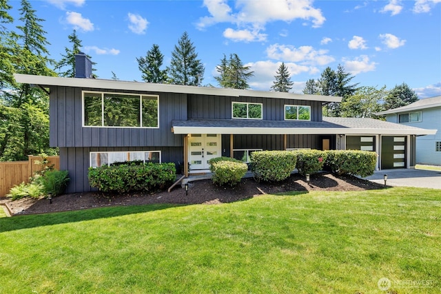 17517 NE 22nd Ct, Redmond, WA 98052 - view of front of home featuring a chimney, an attached garage, concrete driveway, and board and batten siding