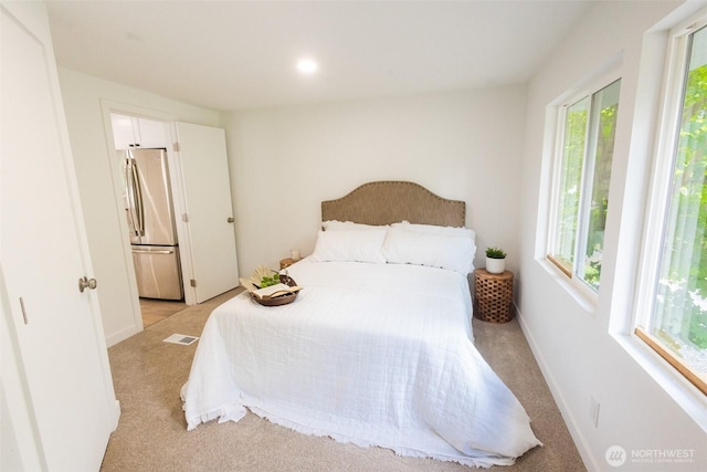 3333 228th St Unit 42, Bothell, WA 98021 - bedroom with freestanding refrigerator, light colored carpet, and recessed lighting