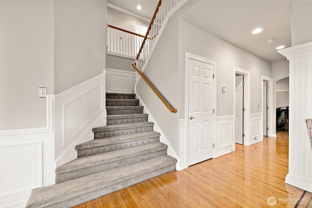 12153 SE 307th Pl, Auburn, WA 98092 - staircase with a decorative wall, wood finished floors, wainscoting, and recessed lighting