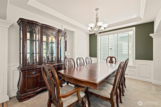 12153 SE 307th Pl, Auburn, WA 98092 - dining room with a chandelier, a tray ceiling, light colored carpet, a wainscoted wall, and a decorative wall