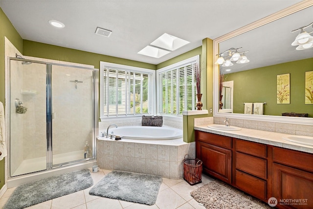 12153 SE 307th Pl, Auburn, WA 98092 - bathroom with a skylight, a garden tub, tile patterned floors, double vanity, and a stall shower