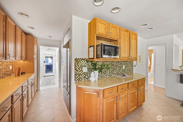 1309 NW Norcross Way, Seattle, WA 98177 - kitchen featuring stainless steel appliances, light tile patterned floors, backsplash, and baseboards