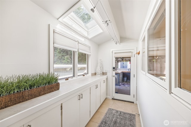 1309 NW Norcross Way, Seattle, WA 98177 - entryway with a skylight, light tile patterned flooring, and baseboards