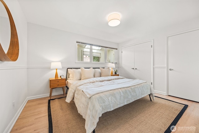 1309 NW Norcross Way, Seattle, WA 98177 - bedroom featuring light wood-style flooring, baseboards, and a closet