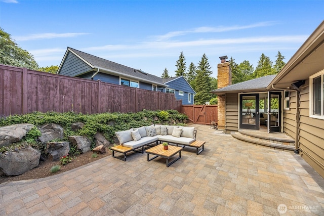 1309 NW Norcross Way, Seattle, WA 98177 - fenced backyard with an outdoor hangout area, a patio area, and a gate