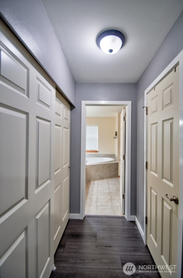 17639 Dusty Ct SW, Tenino, WA 98589 - hallway featuring wood finished floors and baseboards