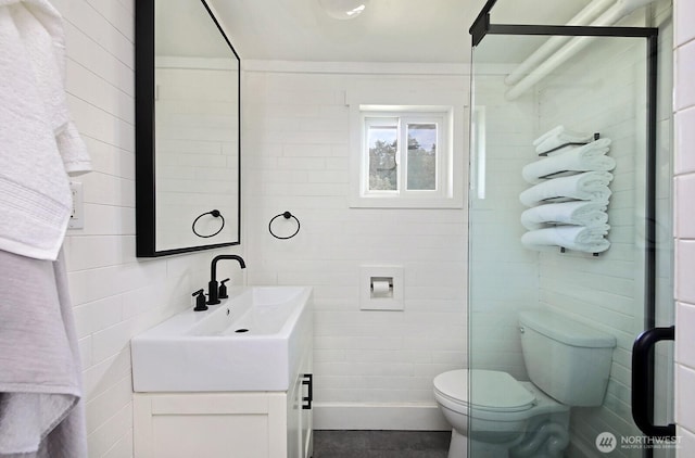 3596 Shell St, Greenbank, WA 98253 - bathroom featuring tile walls, toilet, and vanity