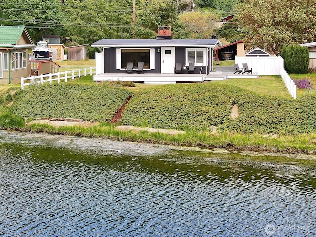 3596 Shell St, Greenbank, WA 98253 - rear view of property with a chimney and a water view