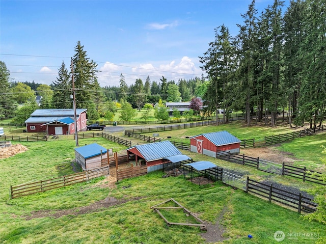 20460 Noll Rd NE, Poulsbo, WA 98370 - view of green lawn featuring an exterior structure, an outbuilding, and a view of rural / pastoral area