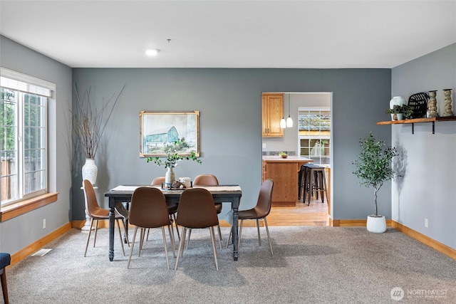 20460 Noll Rd NE, Poulsbo, WA 98370 - dining room featuring light colored carpet and baseboards