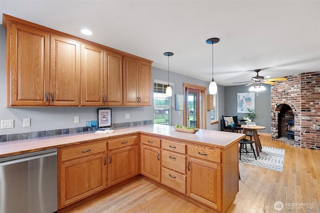 20460 Noll Rd NE, Poulsbo, WA 98370 - kitchen with dishwasher, a ceiling fan, light wood-type flooring, pendant lighting, and recessed lighting