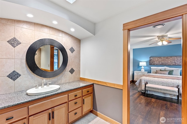 20460 Noll Rd NE, Poulsbo, WA 98370 - bathroom featuring connected bathroom, vanity, tasteful backsplash, baseboards, and ceiling fan