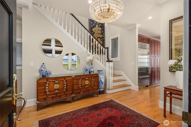 4864 Rockaway Beach Rd NE, Bainbridge Island, WA 98110 - entryway with light wood-style flooring, stairs, a chandelier, baseboards, and recessed lighting