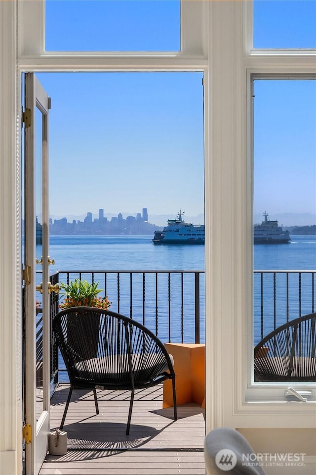 4864 Rockaway Beach Rd NE, Bainbridge Island, WA 98110 - balcony with a water view and a view of skyline