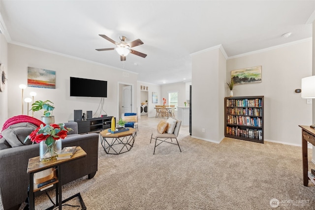 20318 E 67th Ave E, Spanaway, WA 98387 - carpeted living room featuring a ceiling fan, crown molding, baseboards, and independent washer and dryer